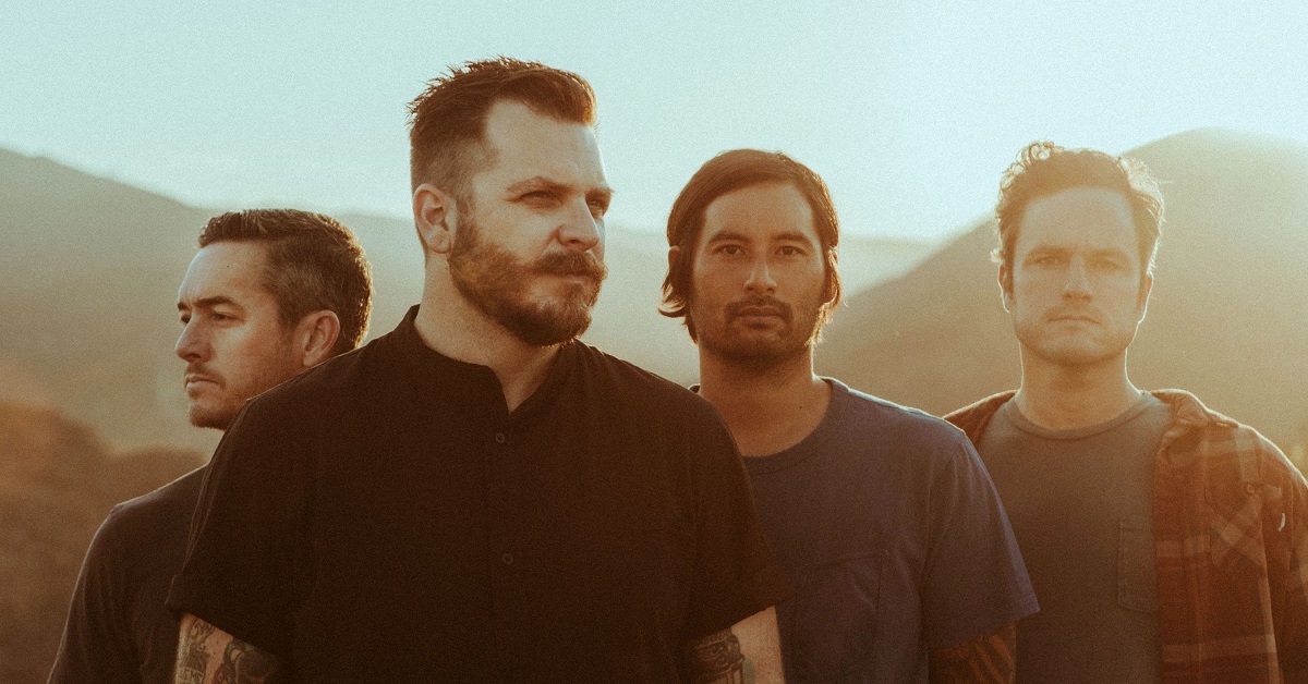 A photo of Thrice standing in the sun
