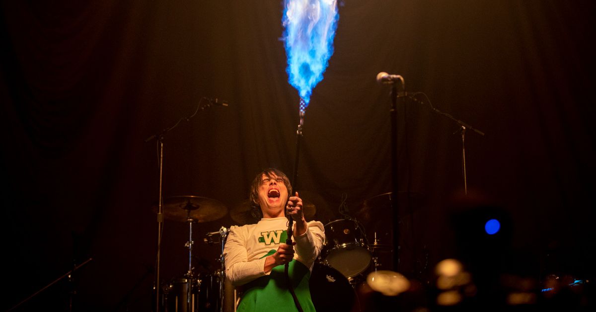 My Chemical Romance lead vocalist Gerard Way shoots flames out of a flame thrower. Photo credit: Allen J. Schaben / Los Angeles Times via Getty Images)
