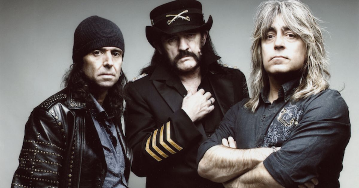 A photo of Motorhead standing against a white backdrop 