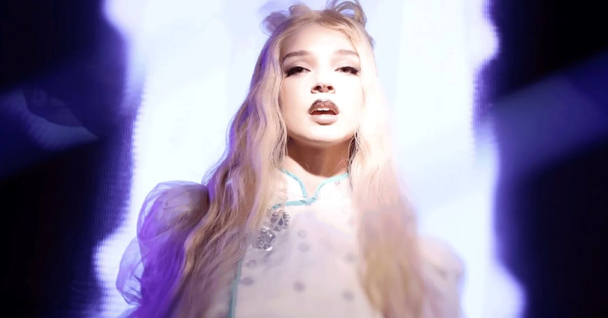 A screenshot of Poppy taken from the 'Spit' video clip. 