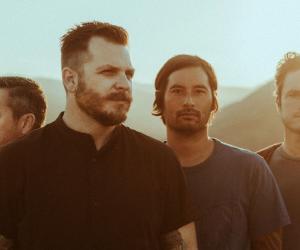 A photo of Thrice standing in the sun