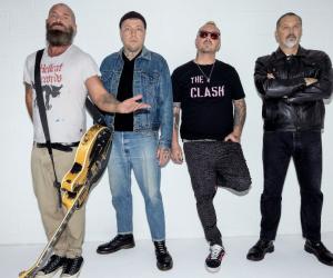 A photo of Rancid standing against a wall
